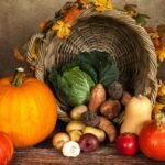 A rustic cornucopia overflowing with fresh autumn vegetables, symbolizing abundance and harvest.